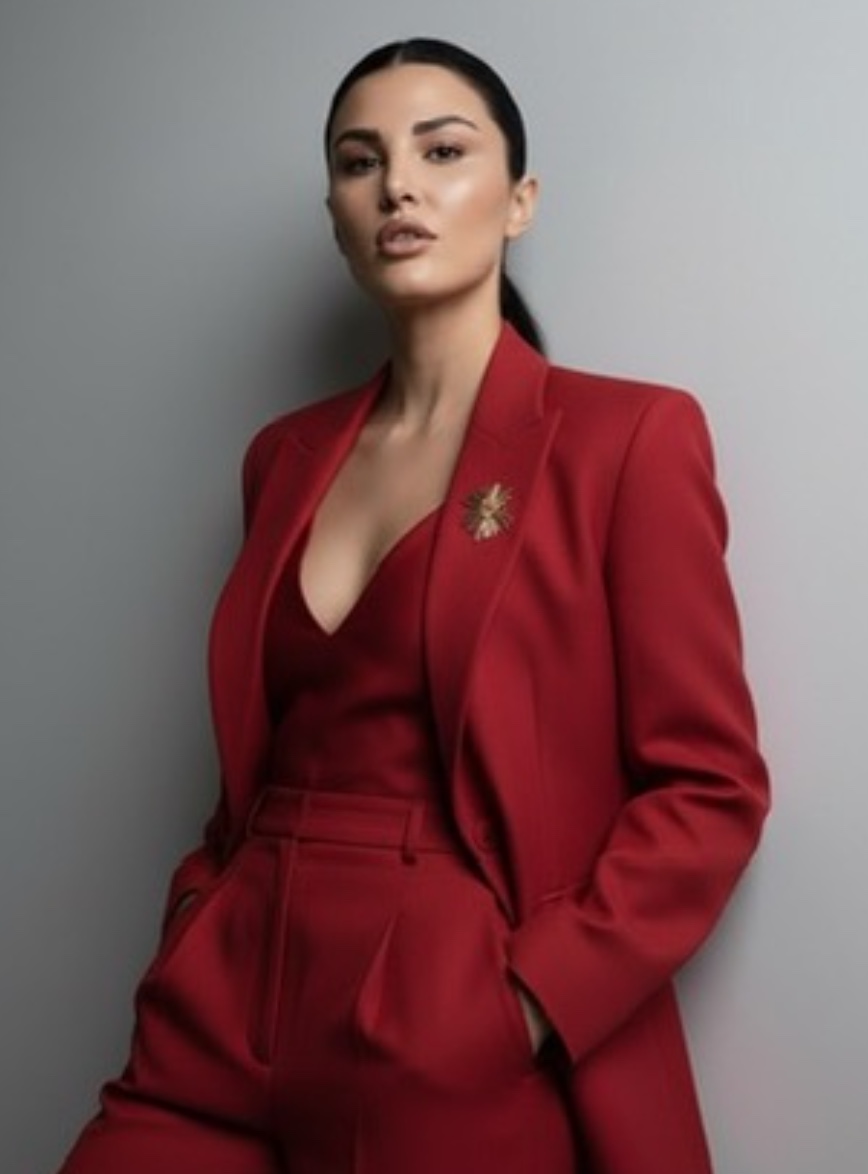 Charlotte, founder of Charlotte's Lingerie, in a red suit
